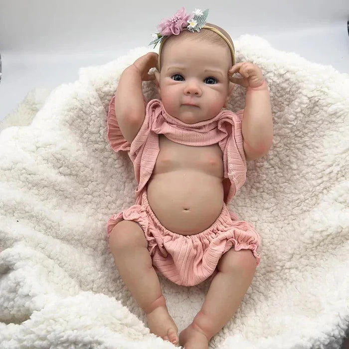 Bebê Reborn Anahi 49cm, boneca artesanal de silicone com olhos claros, pintura realista e acessórios. Perfeita para crianças 3+, ideal para banho e brincadeiras!