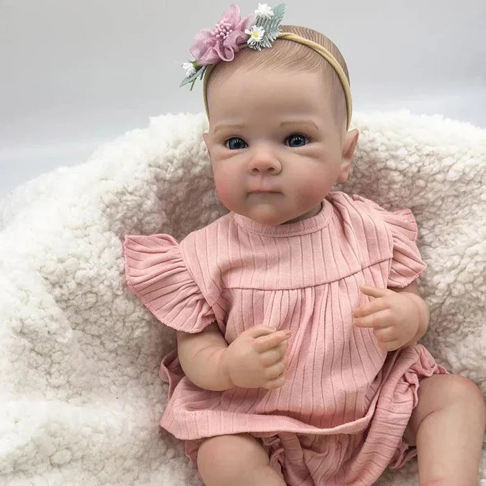 Bebê Reborn Anahi 49cm, boneca artesanal de silicone com olhos claros, pintura realista e acessórios. Perfeita para crianças 3+, ideal para banho e brincadeiras!