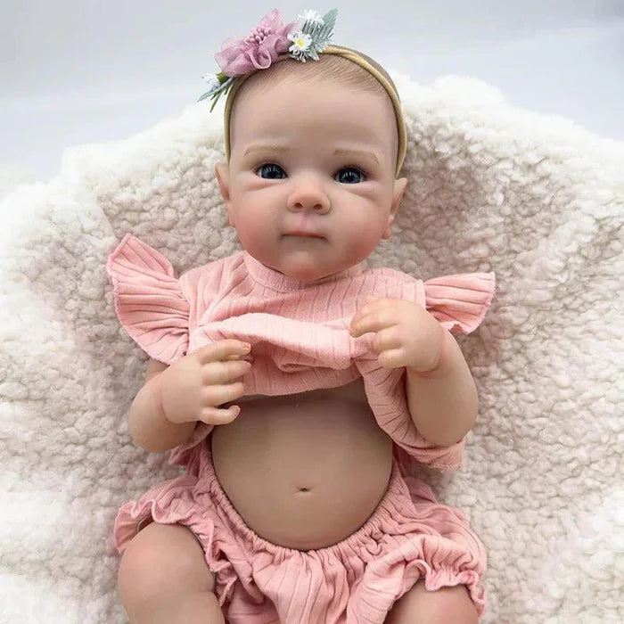 Bebê Reborn Anahi 49cm, boneca artesanal de silicone com olhos claros, pintura realista e acessórios. Perfeita para crianças 3+, ideal para banho e brincadeiras!