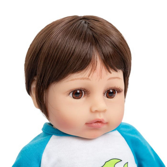 Bebê Reborn Vinícius 48cm, boneco realista de silicone com olhos fixos, cabelo fio a fio e acessórios. Perfeito para crianças 3+, fomenta cuidado e imaginação!