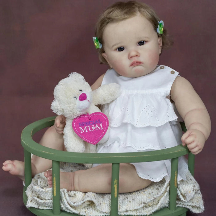 Bebê Reborn Elisa 60cm, boneca realista com corpo macio, olhos vivos, cabelo fio a fio e acessórios. Perfeita para crianças 3+, traz magia e ternura às brincadeiras!