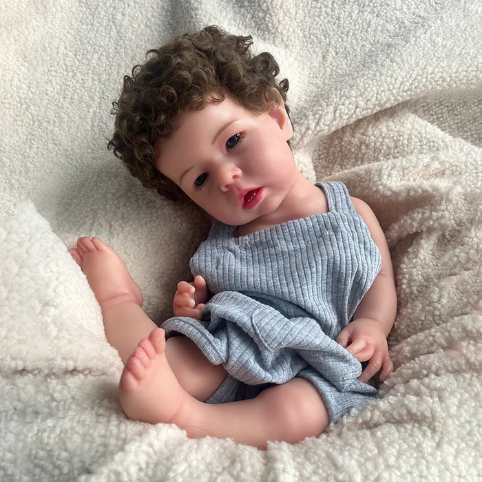 Bebê Reborn Gael, boneca realista de silicone sólido com olhos abertos, membros móveis e acessórios. Perfeita para crianças 3+, traz ternura e magia às brincadeiras!