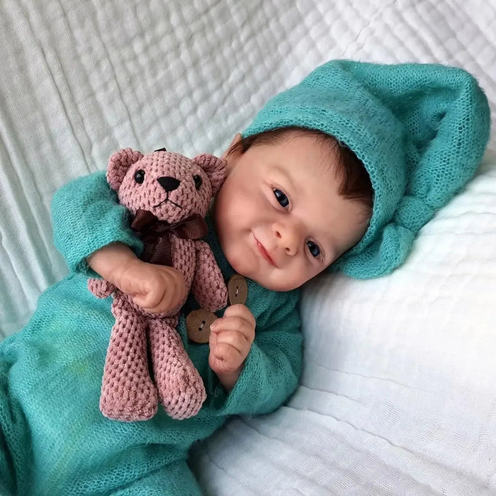 Bebê Reborn Henrique 55cm, boneco realista com corpo macio, olhos vivos, cabelo fio a fio e acessórios. Perfeito para crianças 3+, traz magia e carinho às brincadeiras!