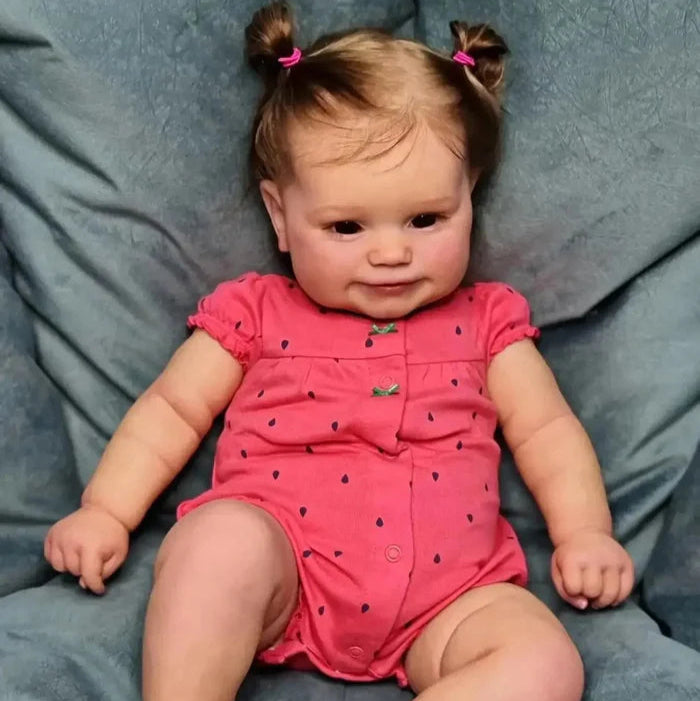Bebê Reborn Jéssica 50cm, boneca realista de vinil com olhos vivos, cabelo fio a fio e acessórios. Perfeita para crianças 3+, traz magia e ternura às brincadeiras!