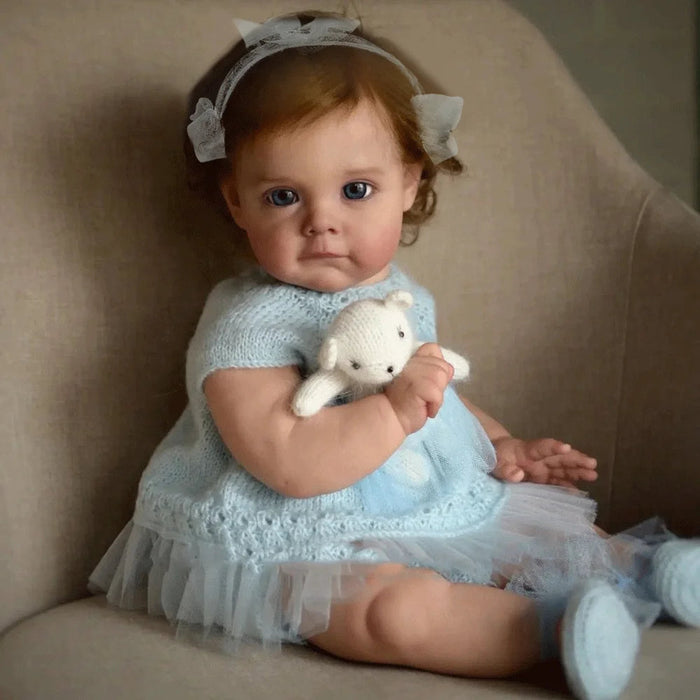 Bebê Reborn Lara 50cm, boneca realista com corpo macio, olhos vivos, cabelo enraizado e acessórios. Ideal para crianças 3+, fomenta carinho, criatividade e aprendizado!
