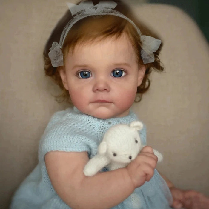 Bebê Reborn Lara 50cm, boneca realista com corpo macio, olhos vivos, cabelo enraizado e acessórios. Ideal para crianças 3+, fomenta carinho, criatividade e aprendizado!
