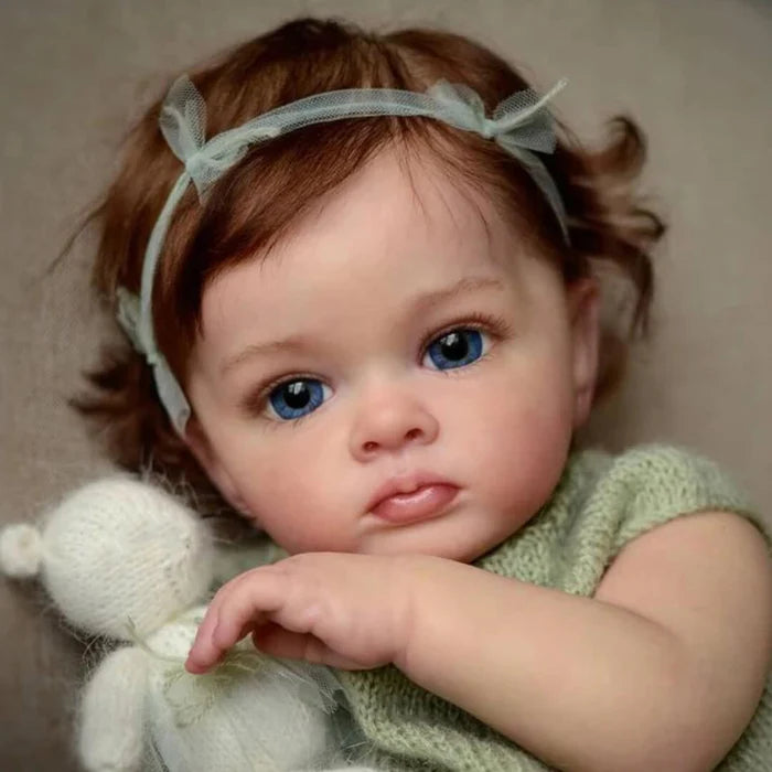 Bebê Reborn Rebeca 55cm, boneca realista com corpo macio, olhos vivos, cabelo fio a fio e acessórios. Perfeita para crianças 3+, traz magia e carinho às brincadeiras!