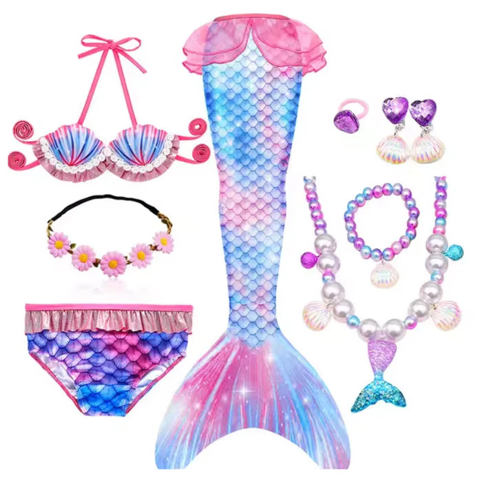 Fantasia Infantil Cauda de Sereia, biquíni, tiara de flores e acessórios. Perfeita para crianças, combina magia e estilo em brincadeiras encantadas e festas!