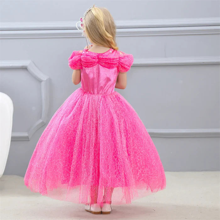 Fantasia Infantil Cinderela Rosa com vestido, coroa, varinha, luvas e colar, em poliéster, algodão e voil. Perfeita para crianças, combina magia e elegância em festas!