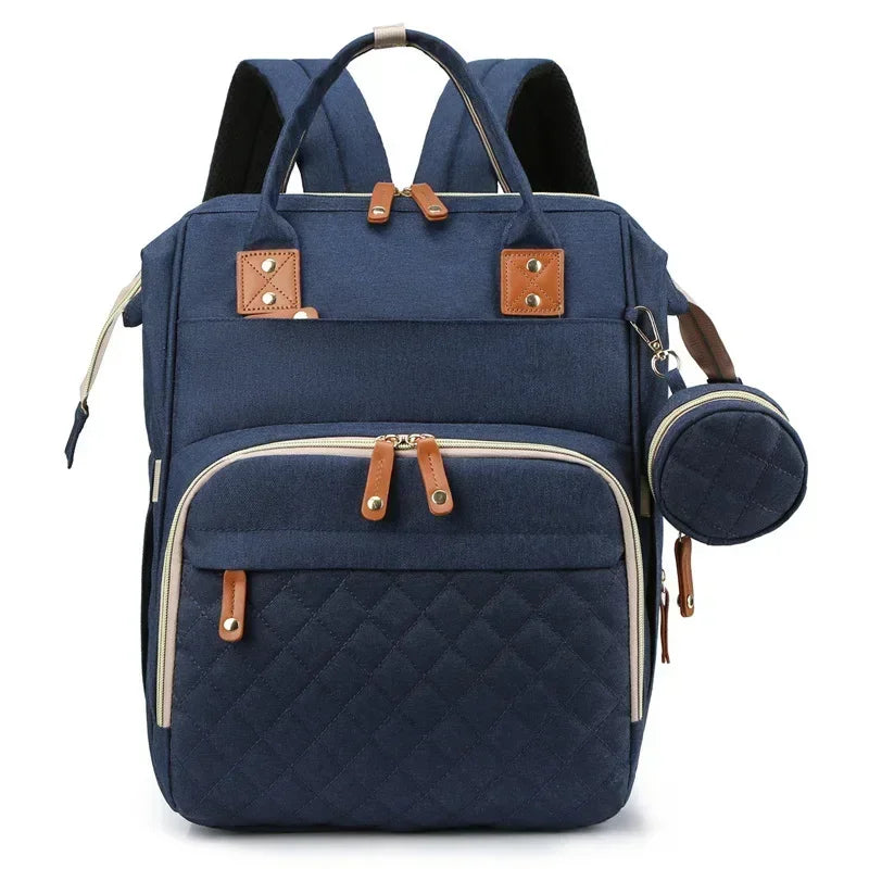 Mochila maternidade 3 em 1 com berço dobrável, compartimento térmico e espaço amplo para os cuidados com o bebê.