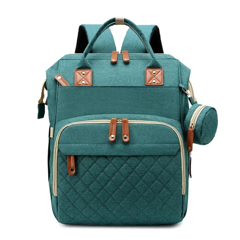 Mochila maternidade 3 em 1 com berço dobrável, compartimento térmico e espaço amplo para os cuidados com o bebê.
