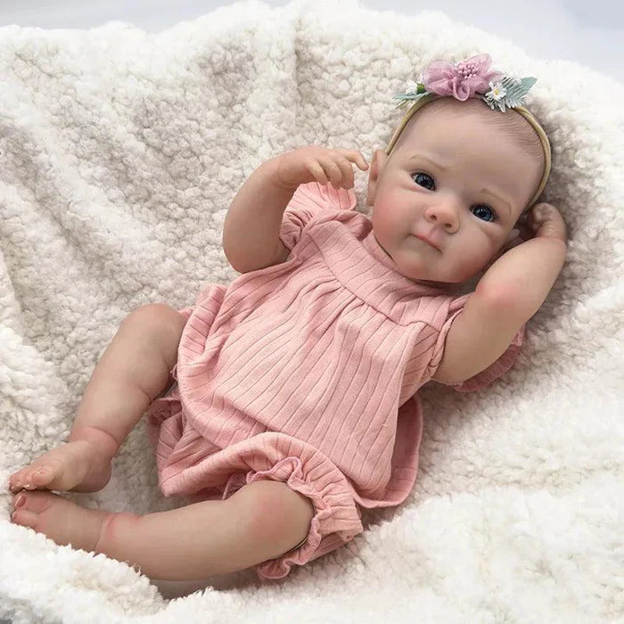 Bebê Reborn Anahi 49cm, boneca artesanal de silicone com olhos claros, pintura realista e acessórios. Perfeita para crianças 3+, ideal para banho e brincadeiras!