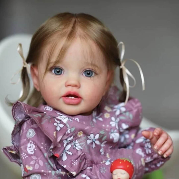Bebê Reborn Antonella 60cm, boneca realista com corpo macio, olhos vivos, cabelo fio a fio e acessórios. Perfeita para crianças 3+, traz magia às brincadeiras!