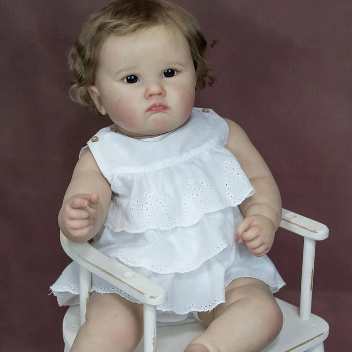 Bebê Reborn Elisa 60cm, boneca realista com corpo macio, olhos vivos, cabelo fio a fio e acessórios. Perfeita para crianças 3+, traz magia e ternura às brincadeiras!