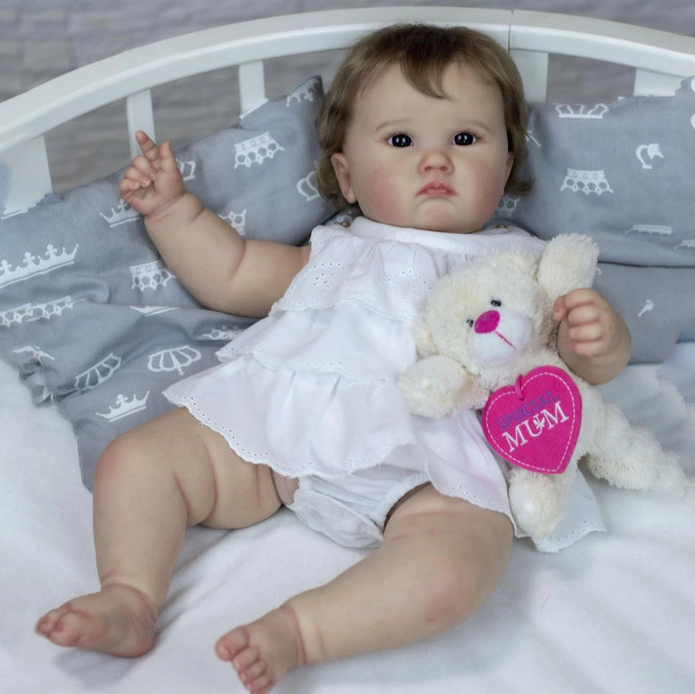 Bebê Reborn Elisa 60cm, boneca realista com corpo macio, olhos vivos, cabelo fio a fio e acessórios. Perfeita para crianças 3+, traz magia e ternura às brincadeiras!