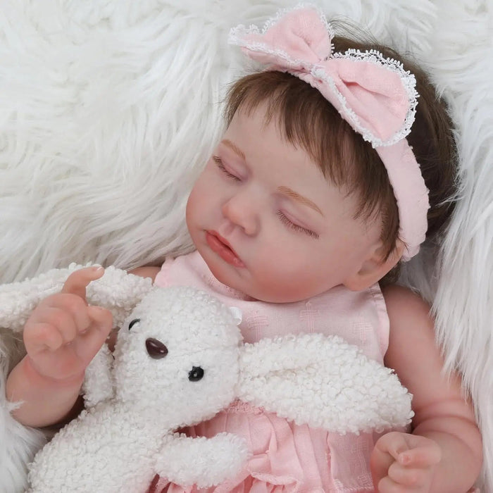 Bebê Reborn Rafaela 50cm, boneca realista com corpo macio, olhos vivos, cabelo enraizado e acessórios. Ideal para crianças 3+, estimula carinho e aprendizado!
