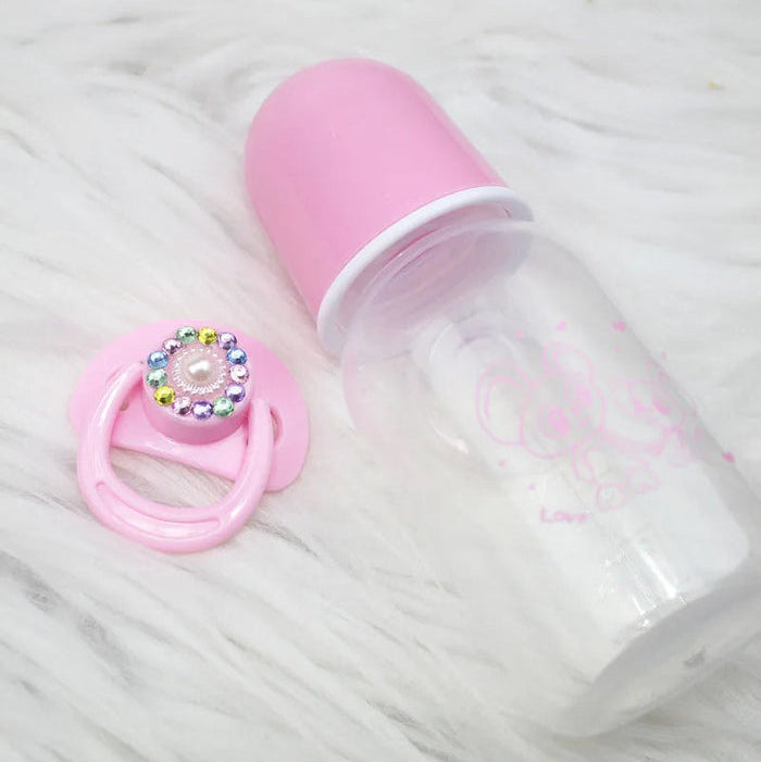 Conjunto Magnético Chupeta e Mamadeira Reborn, 5cm, rosa e branco, plástico ABS seguro. Design encantador para bonecas, 14+, adiciona realismo e carinho à brincadeira!