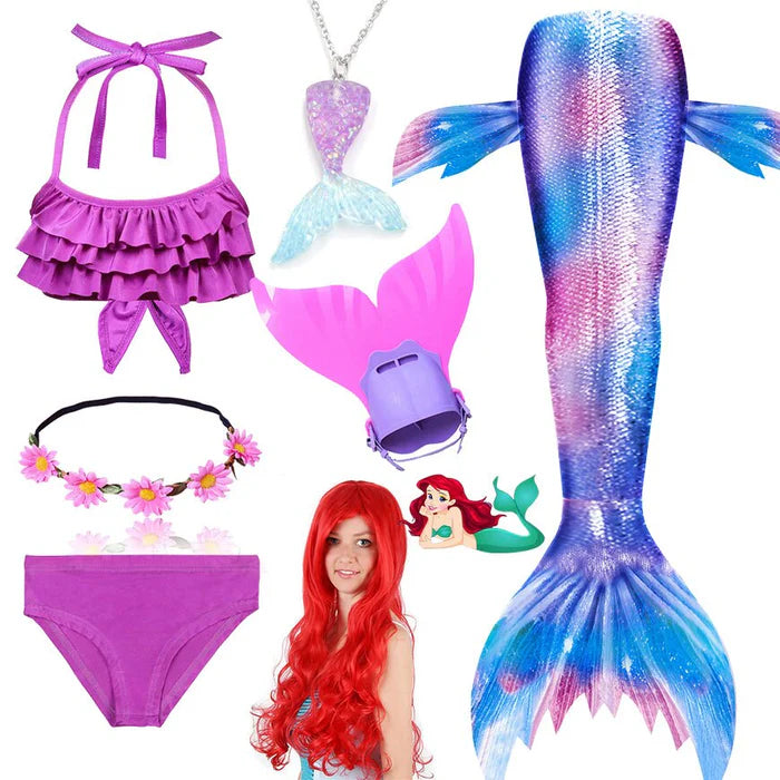 Fantasia Infantil Ariel Pequena Sereia com cauda, biquíni, tiara, nadadeira, colar e cabelo. Perfeita para crianças, combina magia e conforto em aventuras subaquáticas!