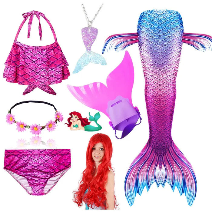 Fantasia Infantil Ariel Pequena Sereia com cauda, biquíni, tiara, nadadeira, colar e cabelo. Perfeita para crianças, combina magia e conforto em aventuras subaquáticas!