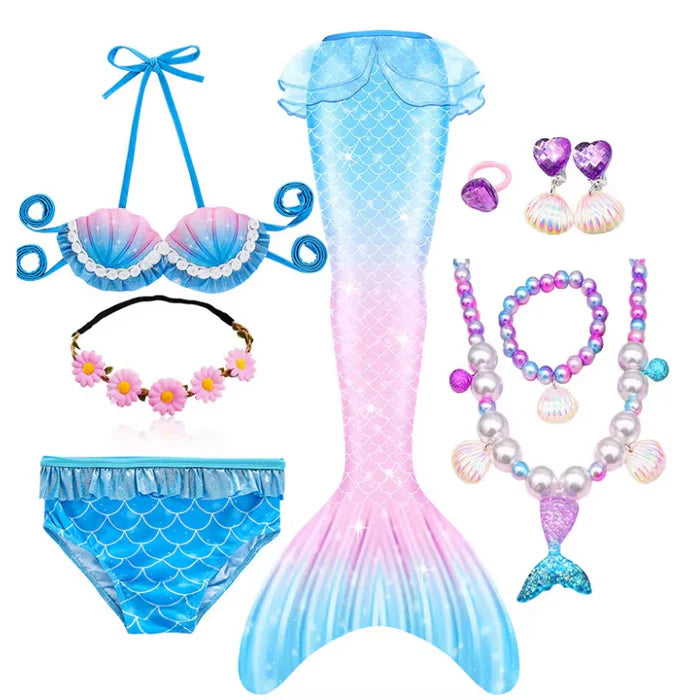 Fantasia Infantil Cauda de Sereia, biquíni, tiara de flores e acessórios. Perfeita para crianças, combina magia e estilo em brincadeiras encantadas e festas!