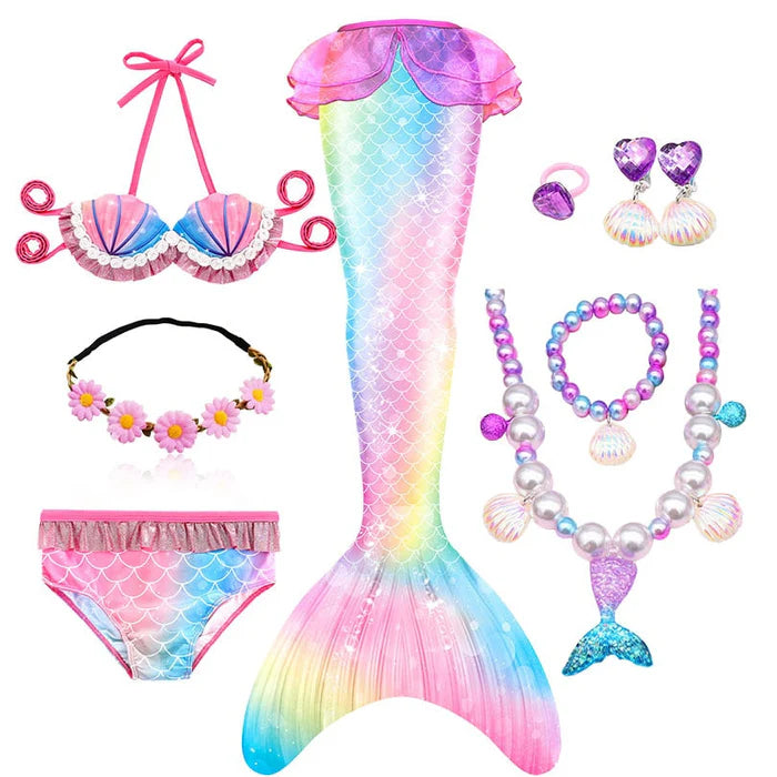 Fantasia Infantil Cauda de Sereia, biquíni, tiara de flores e acessórios. Perfeita para crianças, combina magia e estilo em brincadeiras encantadas e festas!