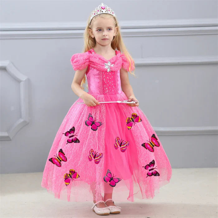 Fantasia Infantil Cinderela Rosa com vestido, coroa, varinha, luvas e colar, em poliéster, algodão e voil. Perfeita para crianças, combina magia e elegância em festas!