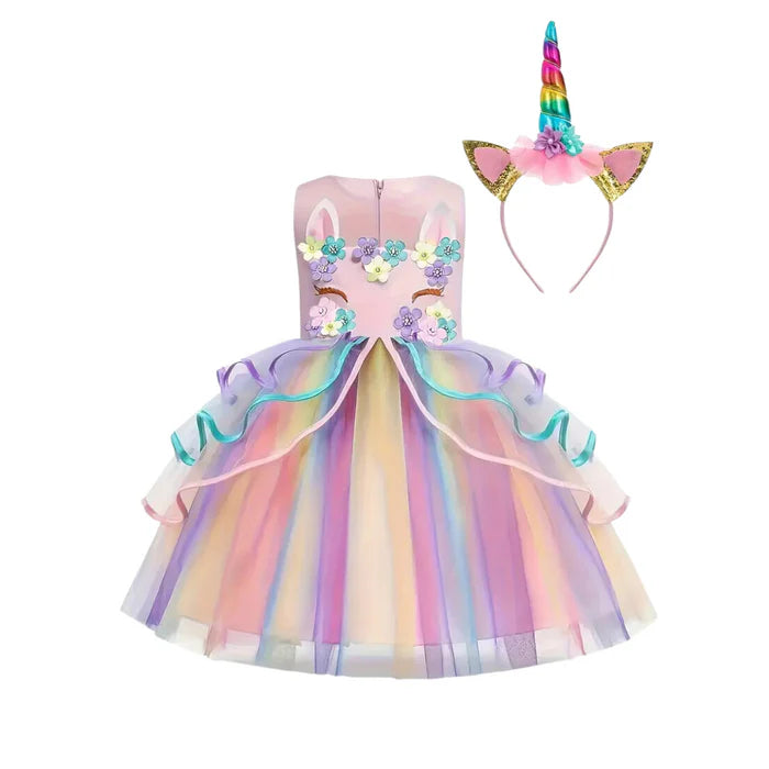 Fantasia Infantil Unicórnio com vestido, arquinho e asa, em poliéster, algodão e tule. Perfeita para crianças, combina magia e qualidade em brincadeiras encantadas!