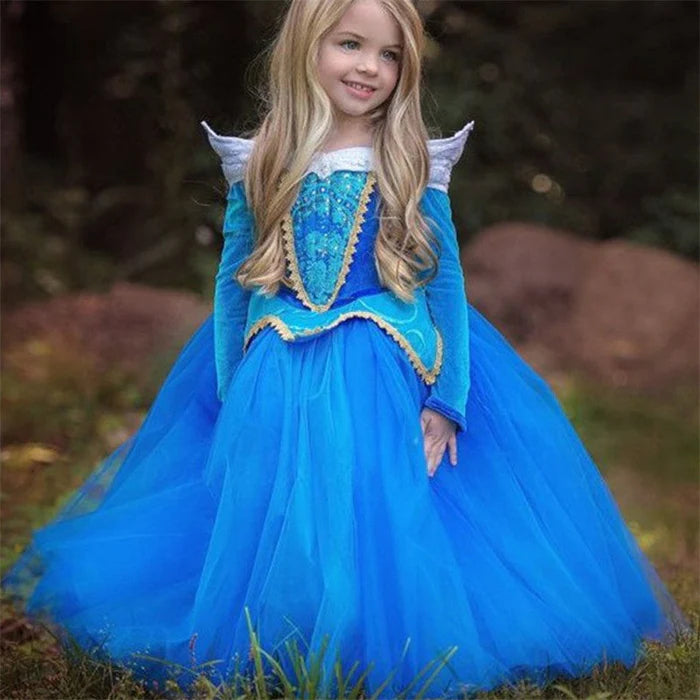 Fantasia Infantil Aurora Azul Clássico com vestido, varinha e coroa, em poliéster e viscose. Perfeita para crianças em festas, com design mágico da Bela Adormecida!